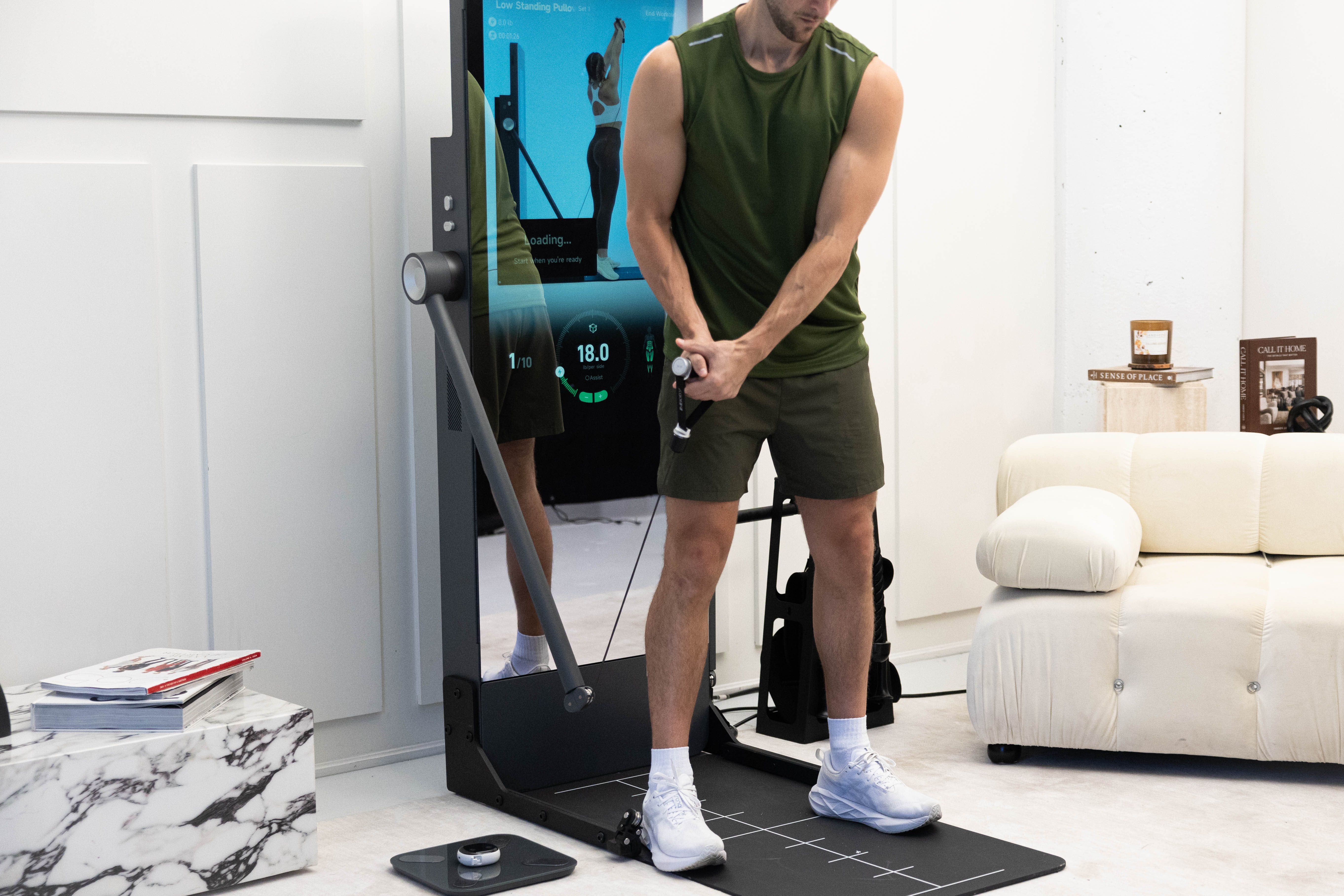 IMBODY Power S connected fitness dashboard showing guided workouts, digital resistance, and progress tracking in a modern home gym