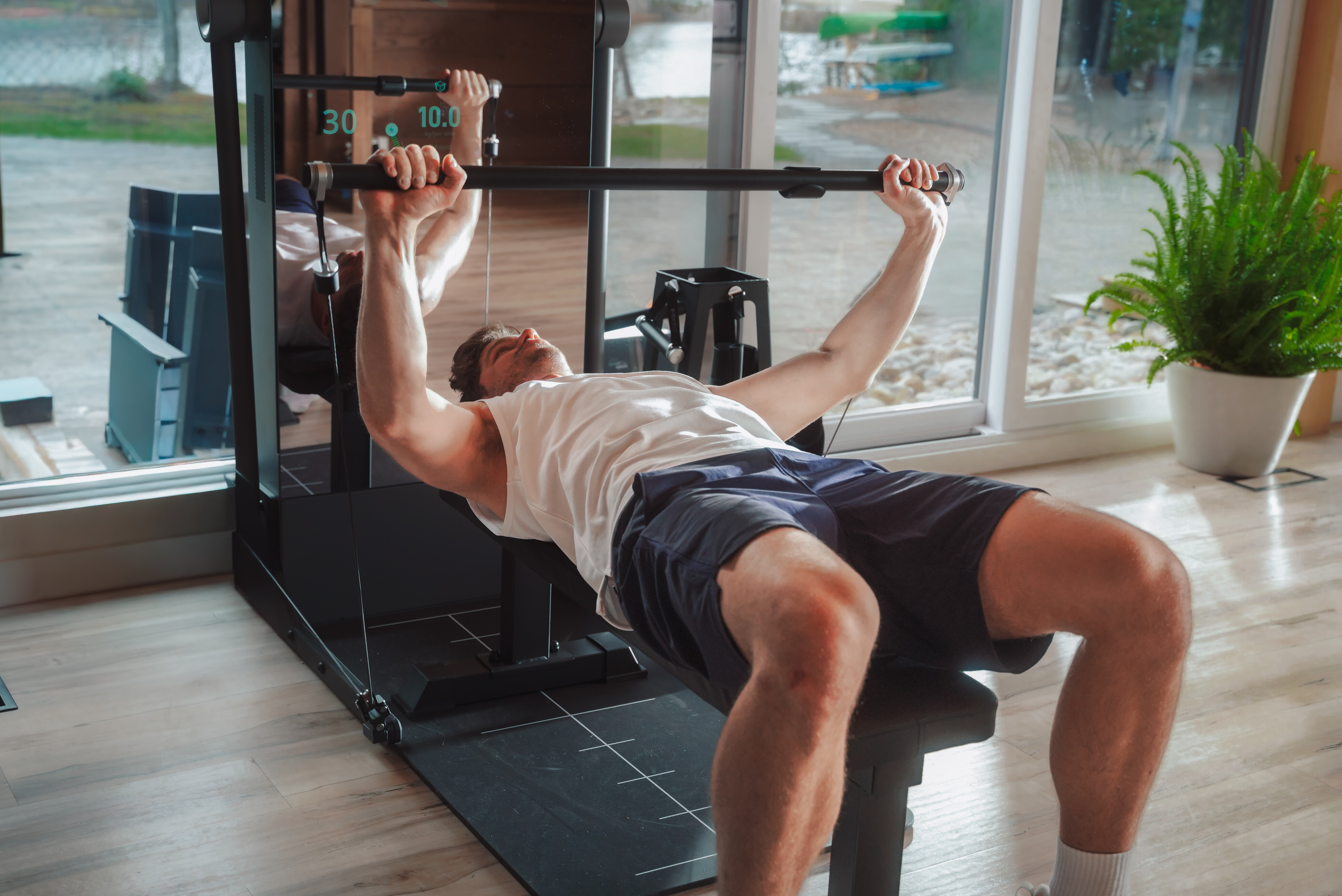 IMBODY Power S Bluetooth Handle controlling resistance during a safe home strength workout